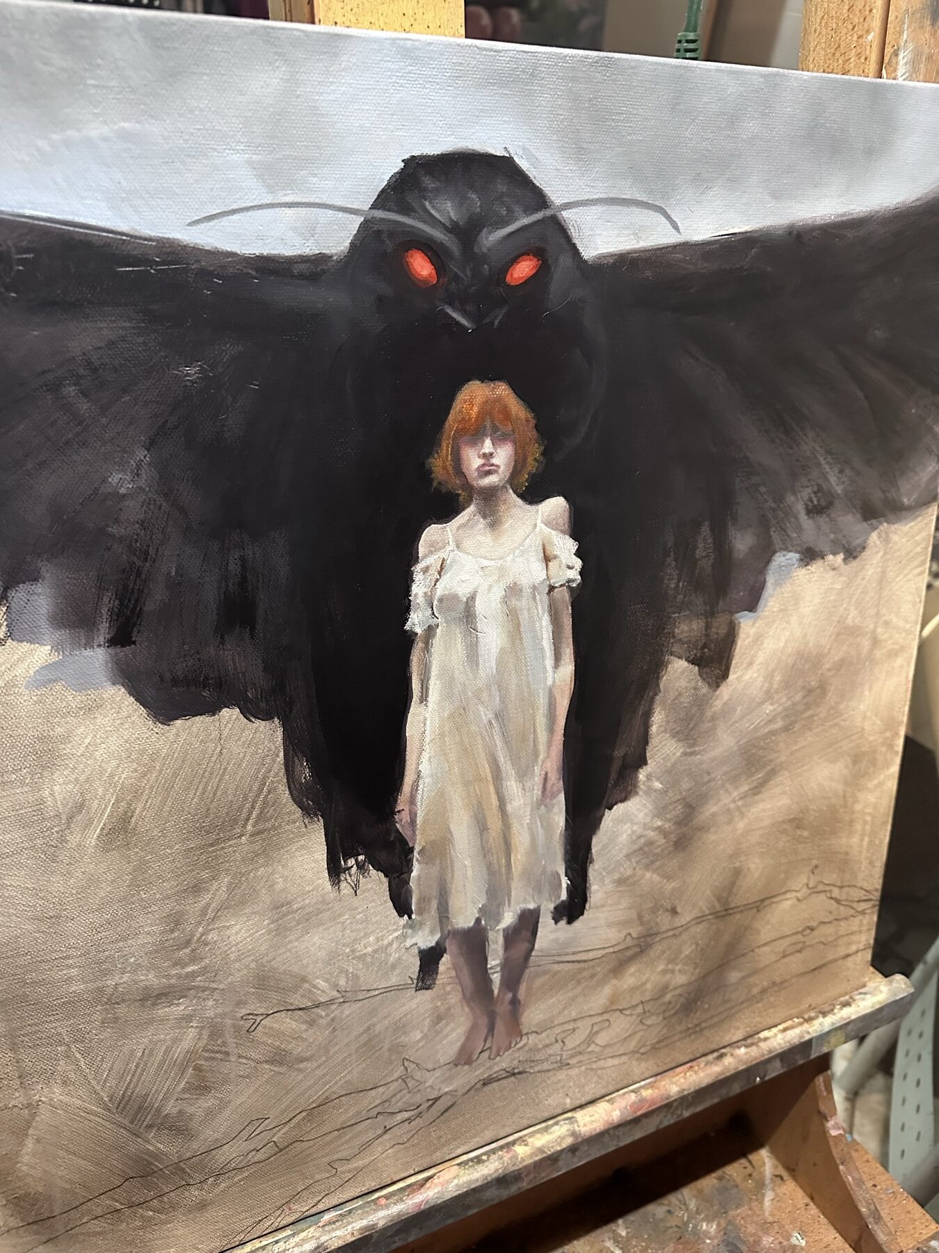 Mothman coming through in layers of fog, field, and red-eyed omen.