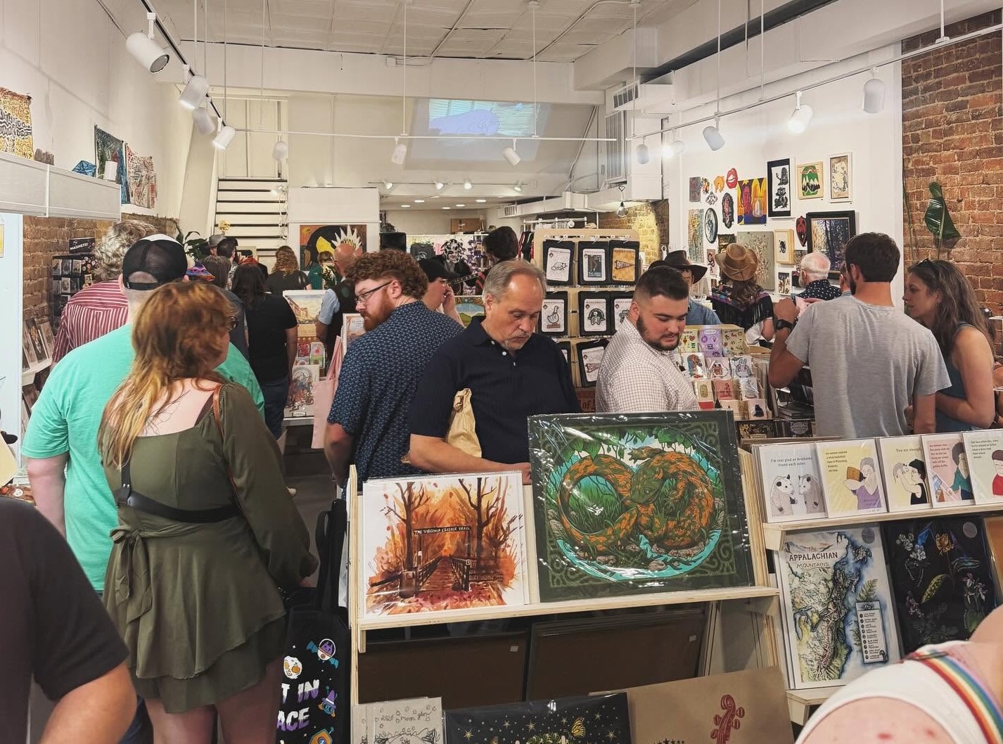 Marty Engle artwork displayed at a Holler House gallery event