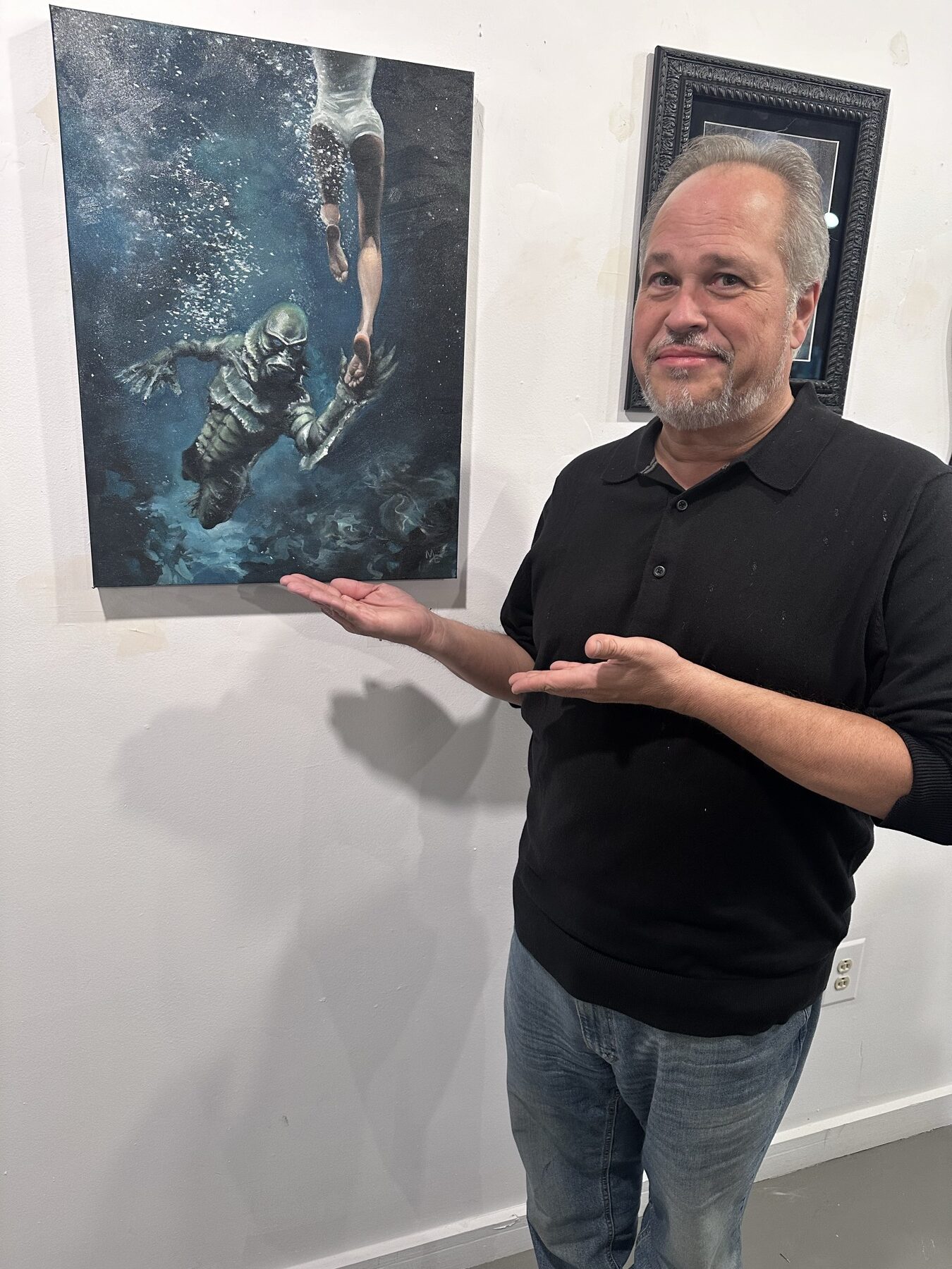 Marty Engle presenting an original oil painting