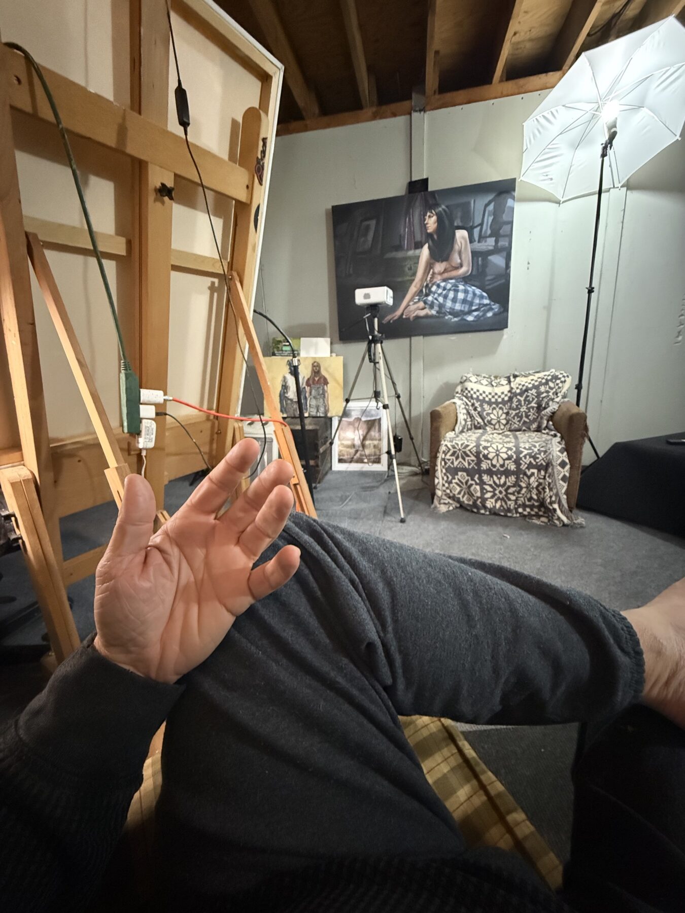 Marty Engle painting studio with easel and artwork