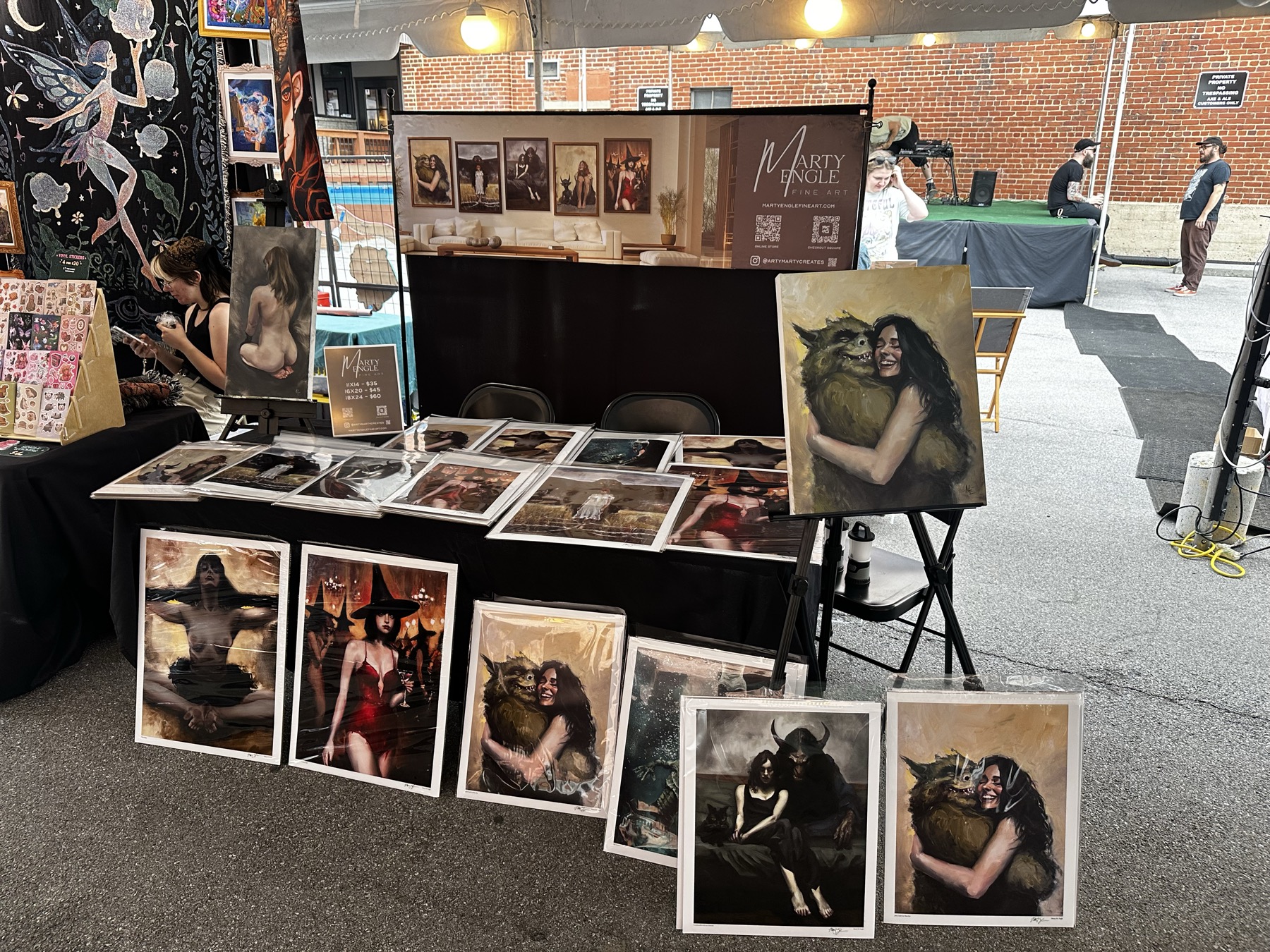 Marty Engle art booth display with original paintings
